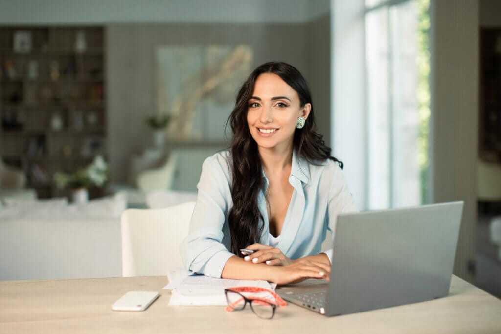 woman using laptop indoors home office